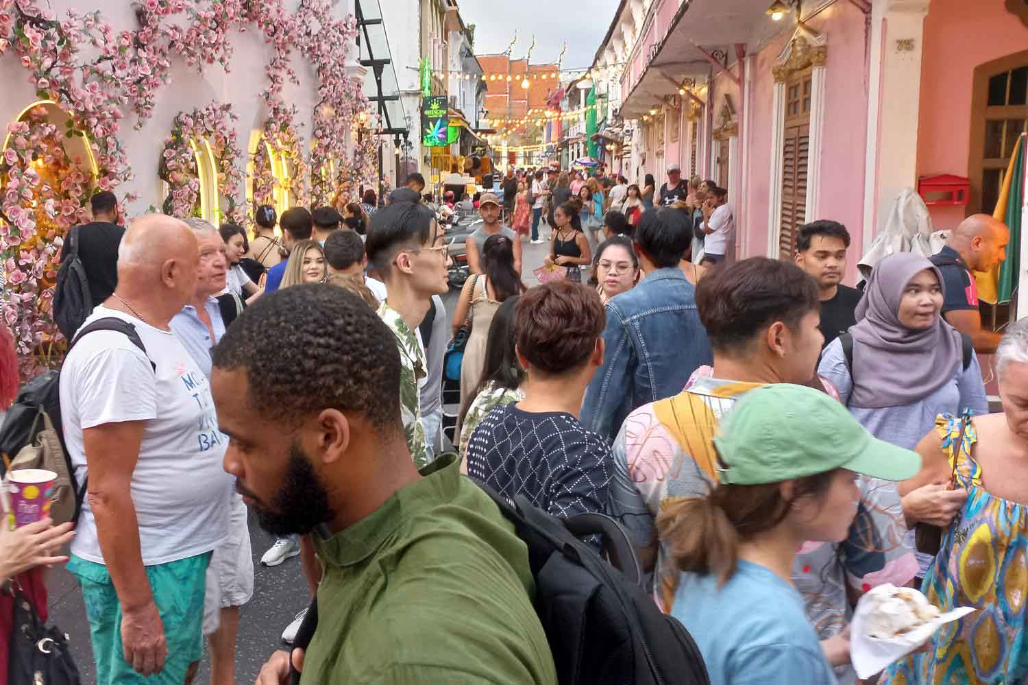 Tourists crowd old town Phuket, a favourite with international arrivals from Europe and Russia who travel to the resort island for the warm weather. (Photo: Achadtaya Chuenniran)