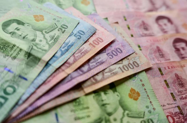 This photo illustration shows baht banknotes. (Photo: AFP)