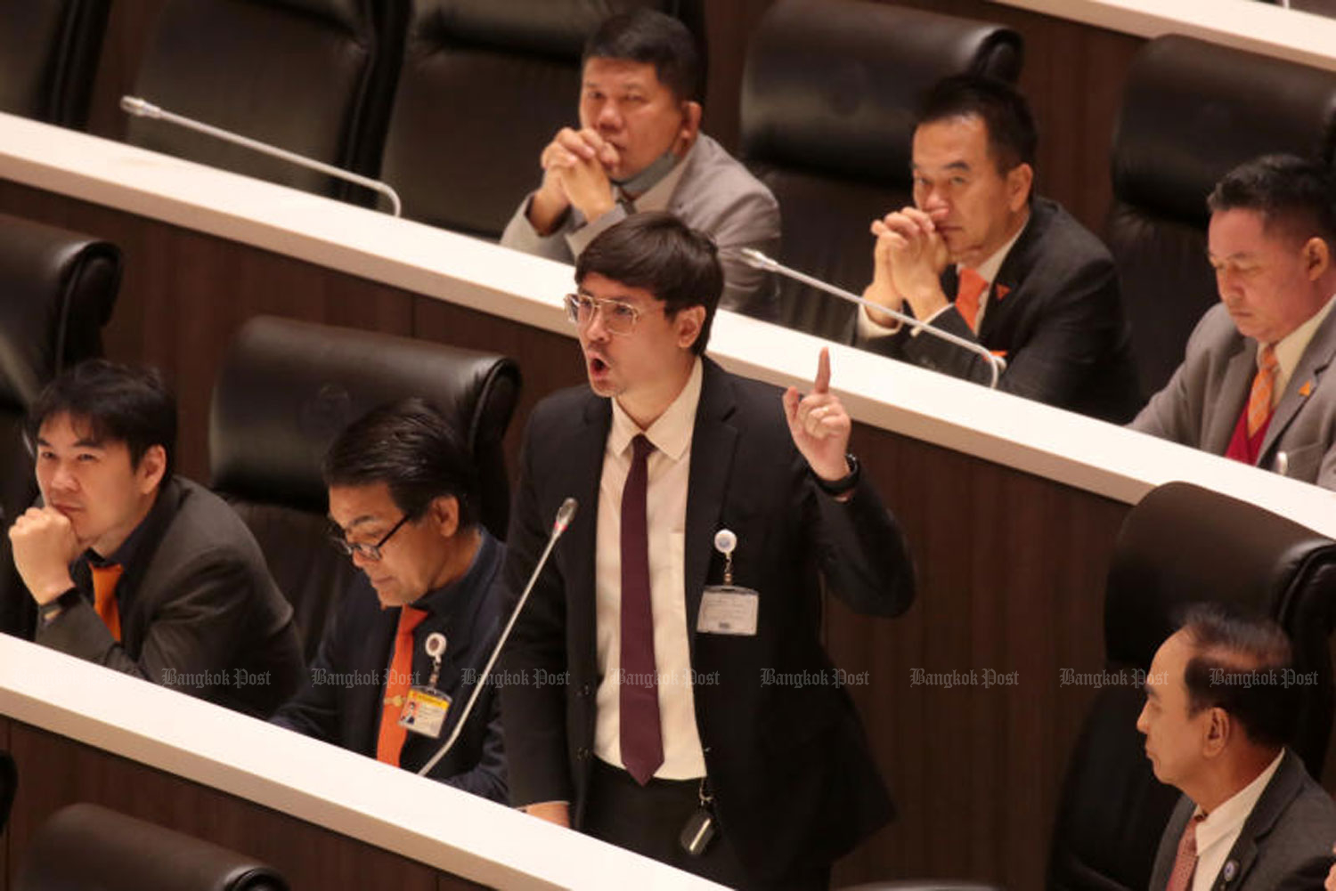 Move Forward MP Rangsiman Rome asks questions about grey business activities in Thailand and accuses a senator with the Thai initial “Or” of laundering money from the drug trade during a parliamentary debate in February. (Photo: Chanat Katanyu)