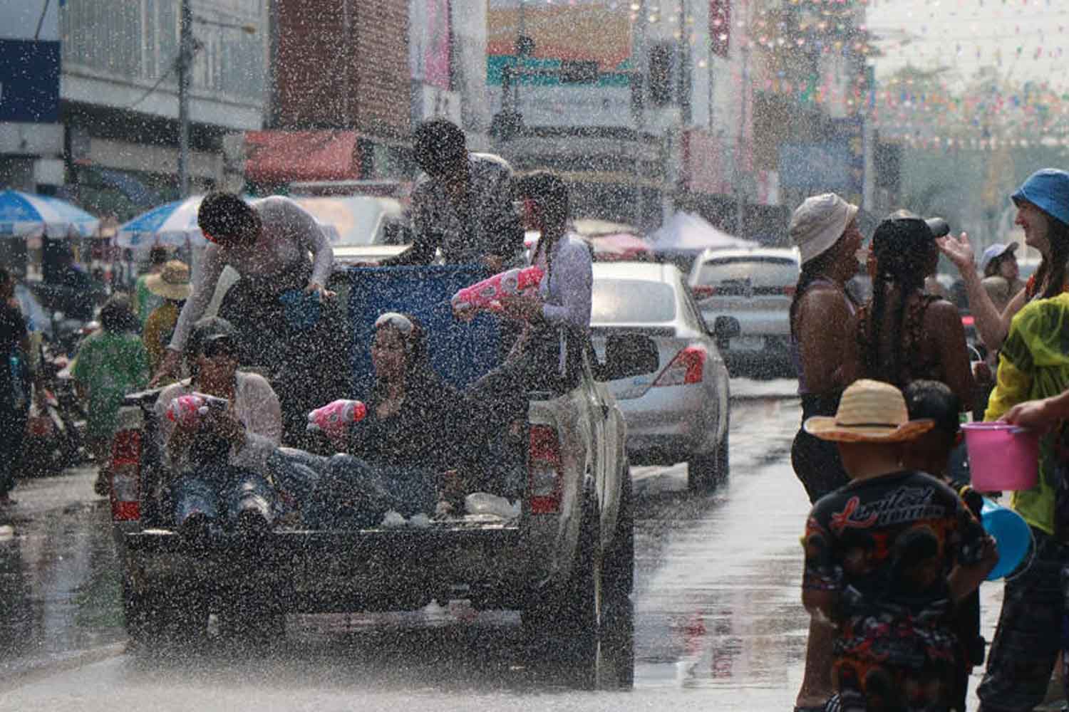 People enjoy splashing water in Muang district of Phitsanulok on Songkran Day on Thursday. (Photo: Chinnawat Singha)