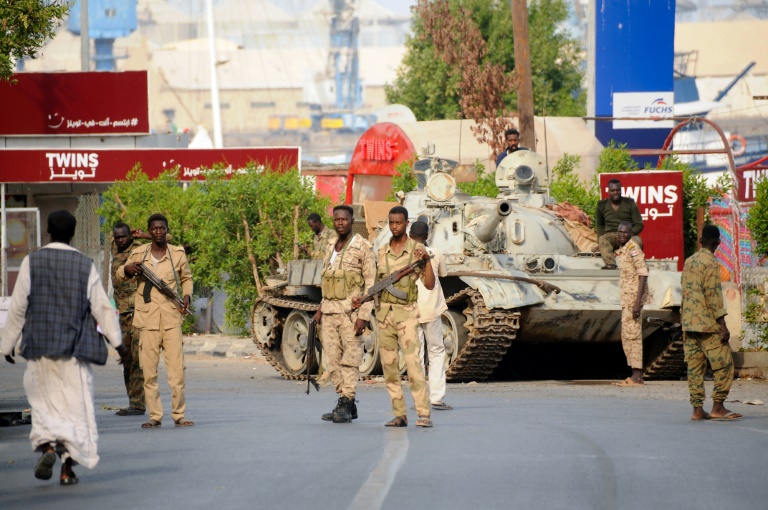 Sudanese army soldiers, loyal to army chief Abdel Fattah al-Burhan, man a position in the Red Sea city of Port Sudan Fears mount for Sudan ceasefire as former regime members escape