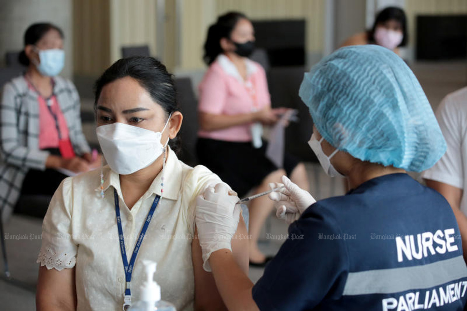 Officials at the parliament receive Covid-19 vaccination last week. (Photo: Chanat Katanyu)