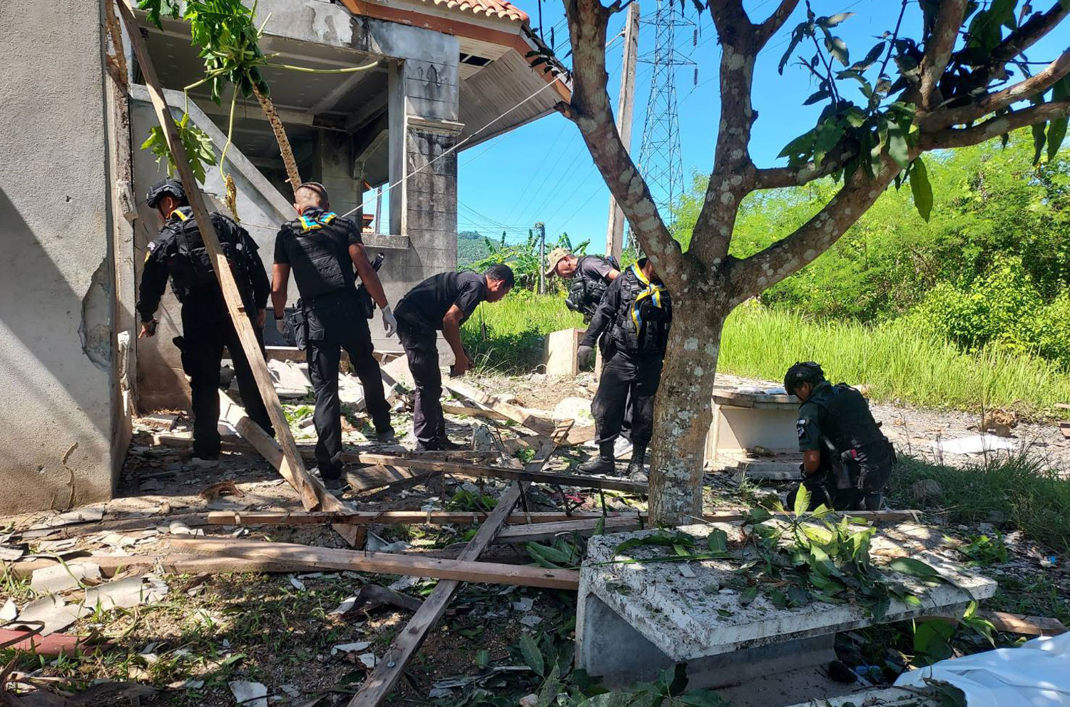 Explosive ordnance disposal (EOD) officers examine the blast site in Yala's Bannang Sata district on May 12, 2023. One army ranger was killed and three other ranger volunteers wounded in the bomb attack. (Photo supplied)