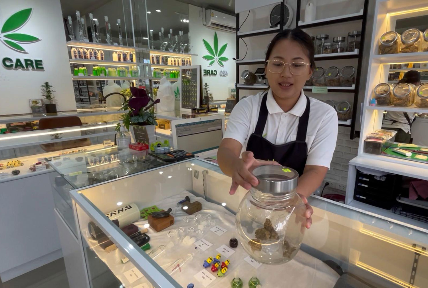 Seangpirun Wongtawan, the owner of a cannabis shop in Khon Kaen, shows her cannabis products. (Photo: Chakrapan Natanri)