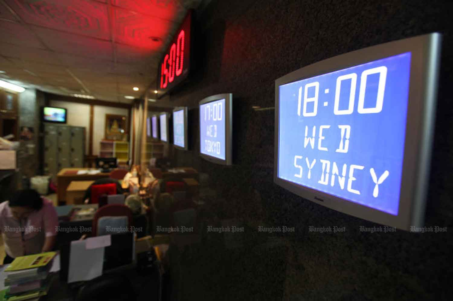 Digital clocks hang on the parliament wall displaying world times in August 2013. (File photo)