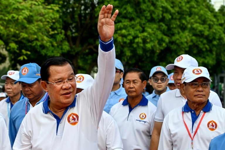 Prime Minister Hun Sen waves to supporters as he kicks off his campaign for re-election in Phnom Penh on Saturday. (Photo: AFP)