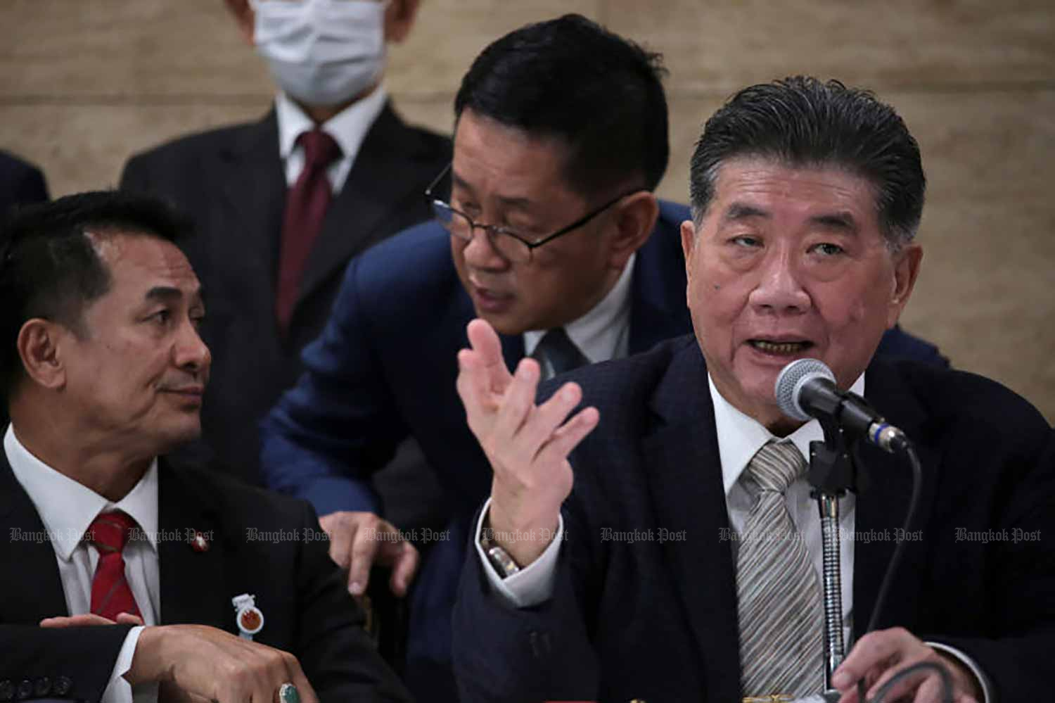 Pheu Thai key figures, from right, its deputy leader Phumtham Wechayachai, secretary-general Prasert Chanthararuangthong, and leader Cholnan Srikaew are at a press conference on the party's bid to form the next government at the parliament on Aug 9. (Photo: Chanat Katanyu)