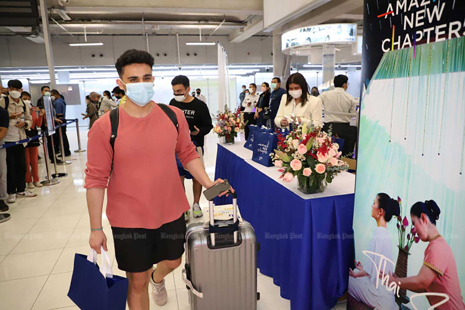 People emerge from the arrival hall at Suvarnabhumi airport after disembarking from a Saudi Arabian Airlines flight from Jeddah via Riyadh on Feb 28, 2022. It was the first direct commercial flight from Saudi Arabia in 32 years, following the recent normalisation of diplomatic ties. (Photo: Varuth Hirunyatheb)