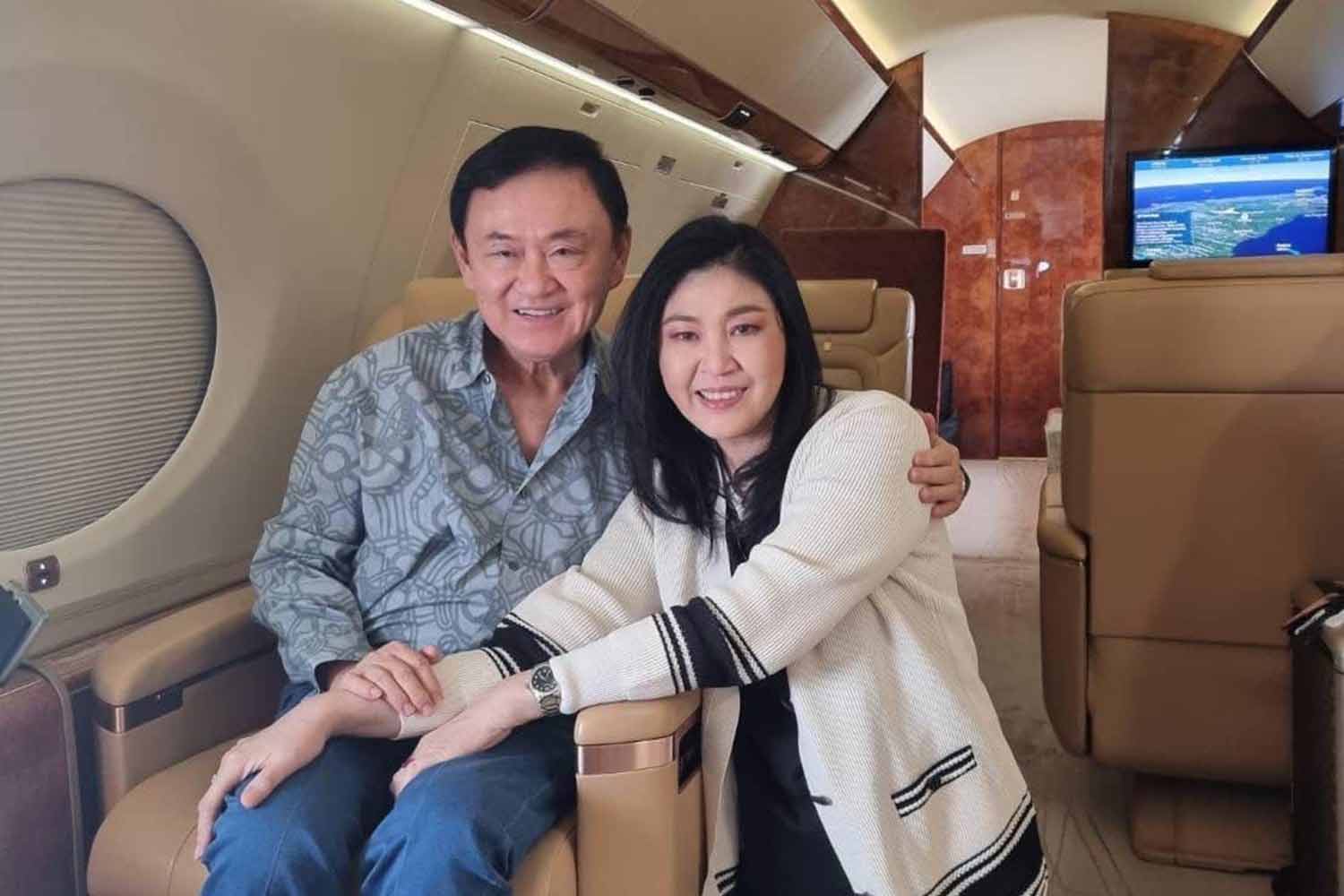 Yingluck wishes Thaksin happiness