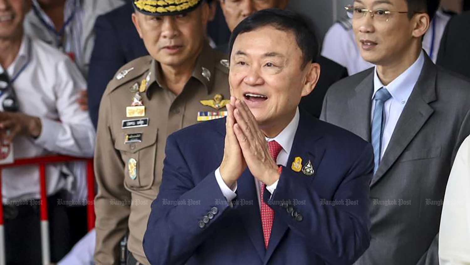 Former prime minister Thaksin Shinawatra greets supporters at Don Mueang airport on Aug 22 as he returned to the country after 15 years of self-imposed exile. (Photo: Pattarapong Chatpattarasill)