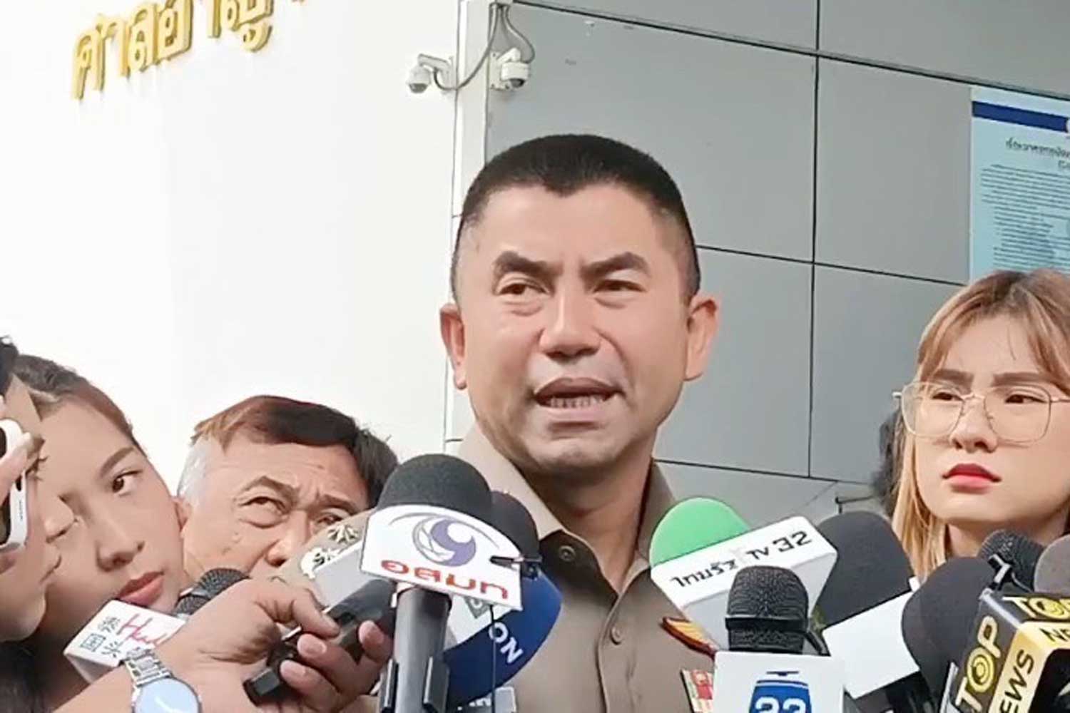 Pol Gen Surachate Hakparn speaks to reporters outside the Criminal Court on Tuesday. (Photo supplied)