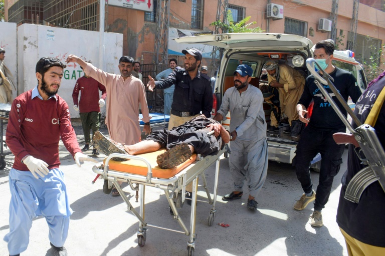 Volunteers prepare to place a blast victim into an ambulance following a suicide bomb attack at a mosque in Quetta, Pakistan on Friday. (Photo: AFP)