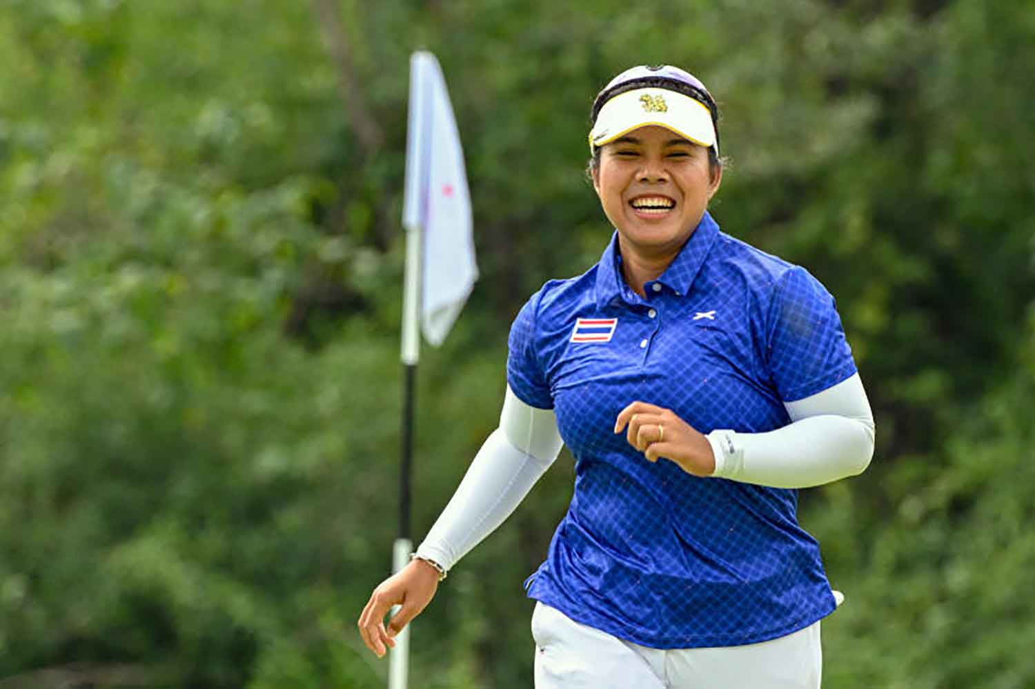 Thailand's Arpichaya Yubol celebrates during women's individual event. (REUTERS/Alfie Lee)