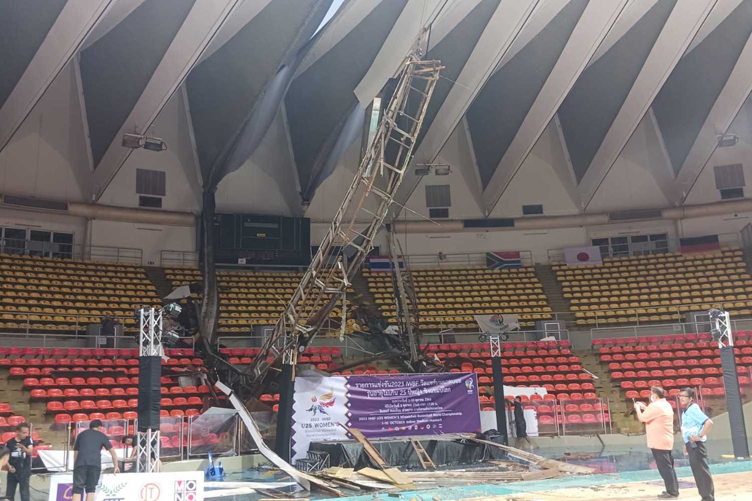 Staff examine the damage after heavy rain caused the partial collapse of the roof at Indoor Stadium Huamark on Tuesday evening. (Photo supplied)