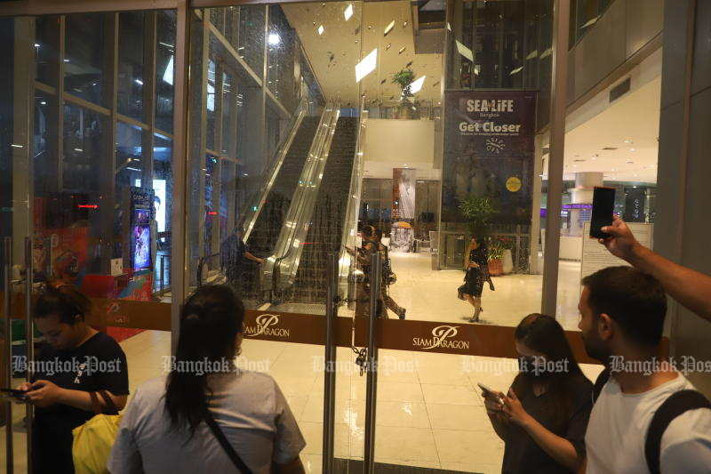 Security officers have temporarily taken control of the area inside Siam Paragon following an incident involving a 14-year-old boy shooting a gun on Tuesday. (Photo: Nutthawat Wichieanbut)