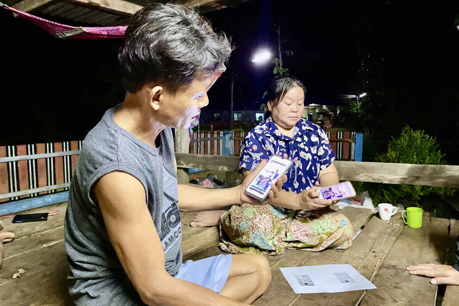 Thawatchai, left, and his wife Thongkhoon Onkaew at their house in Pla Pak district, Nakhon Phanom province. They confirmed their son, Natthaporn, was one of the Thai workers reportedly captured by Hamas militants in Israel. (Photo: Pattanapong Sripiachai)