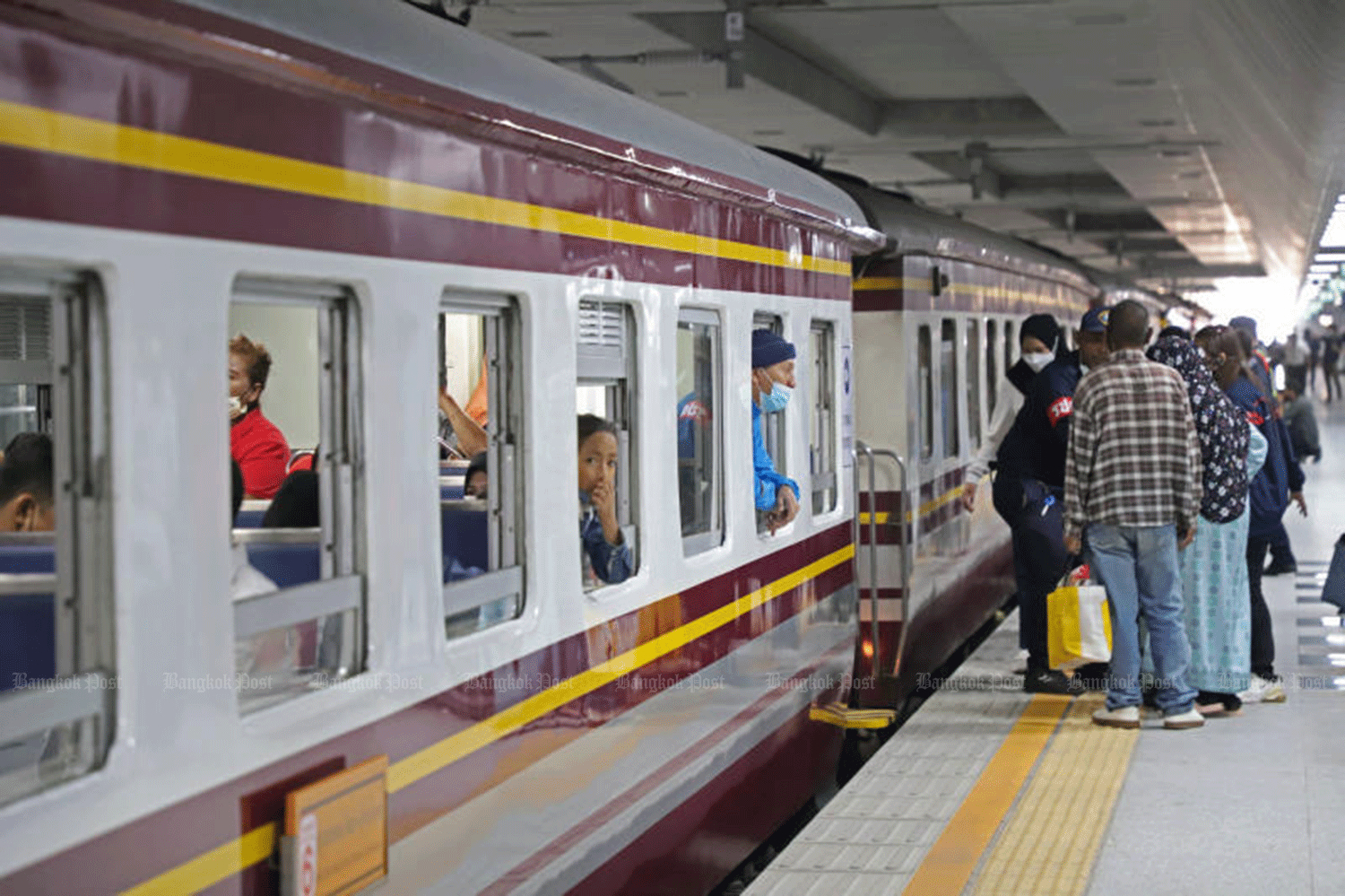 Passengers stand next to a train at Krung Thep Apiwat Central Terminal, the capital’s new and underused main rail station. (Photo: Photo: Varuth Hirunyatheb)