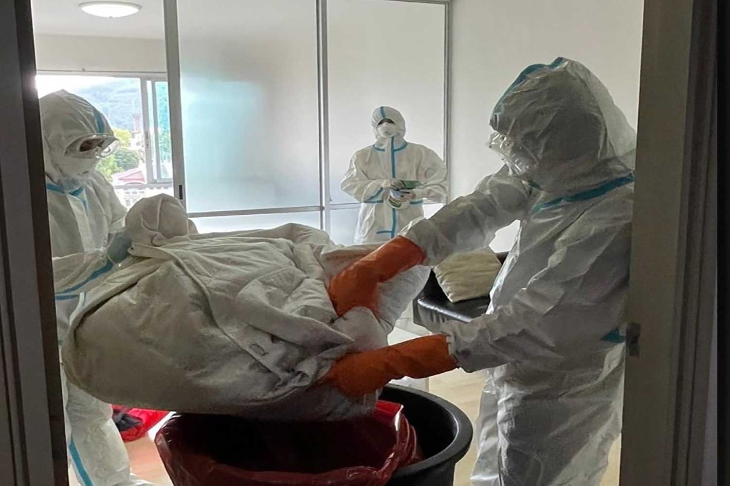 Phuket provincial health officers disinfect a condominium unit where the country detected its first case of monkeypox in July last year. (Photo: Department of Disease Control)