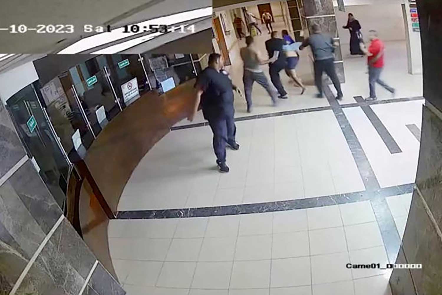 A screen grab of a video released by the Israeli army on November 19, 2023 shows security camera footage of what they say were the Islamic militants of Hamas bringing in a hostage from Israel into the Shifa hospital on the day of the October 7 attack. (Photo: Israel Defense Forces/Handout via REUTERS)