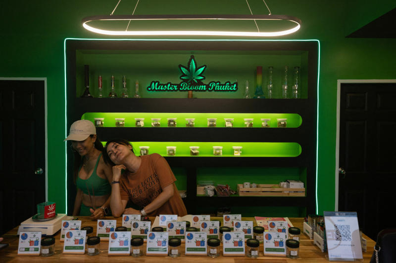 Shopkeepers waiting for customers at a cannabis shop in Phuket
