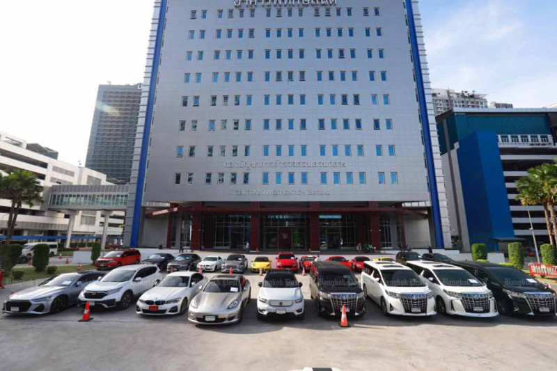 Luxury vehicles seized from The iCon Group suspects are parked in front of the police Central Investigation Bureau in Bangkok on Thursday. (Photos: Pattarapong Chatpattarasill)