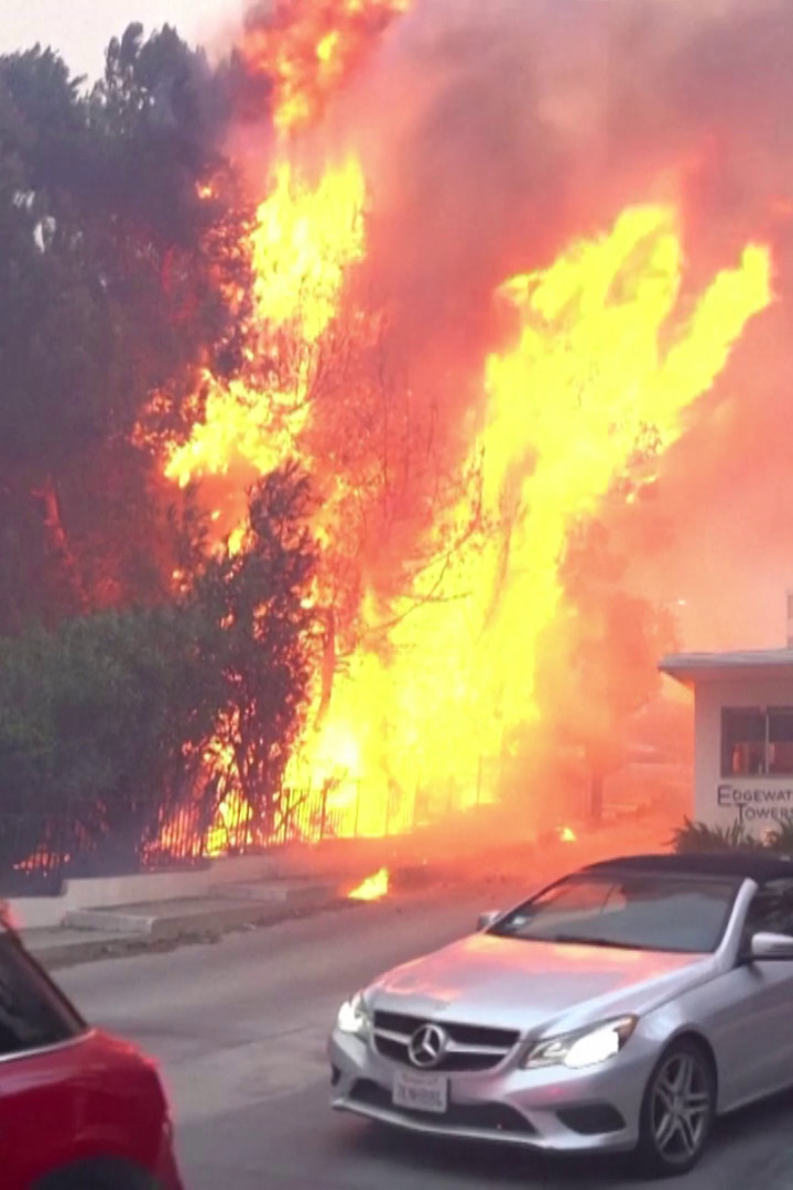 "Let's get out of here": Wildfire burns Los Angeles suburb