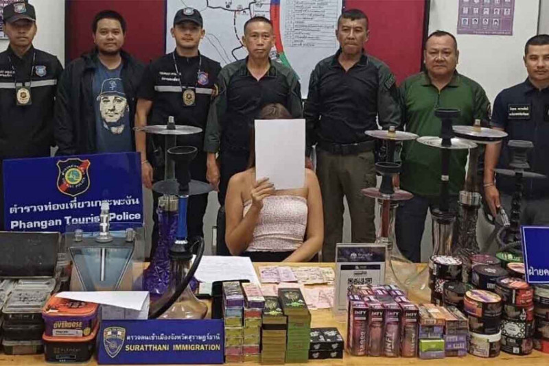 A Russian woman is arrested for selling banned e-cigarettes and baraku smoking devices on Koh Phangan in Thailand's Surat Thani province on Saturday. (Photo: Supapong Chaolan)