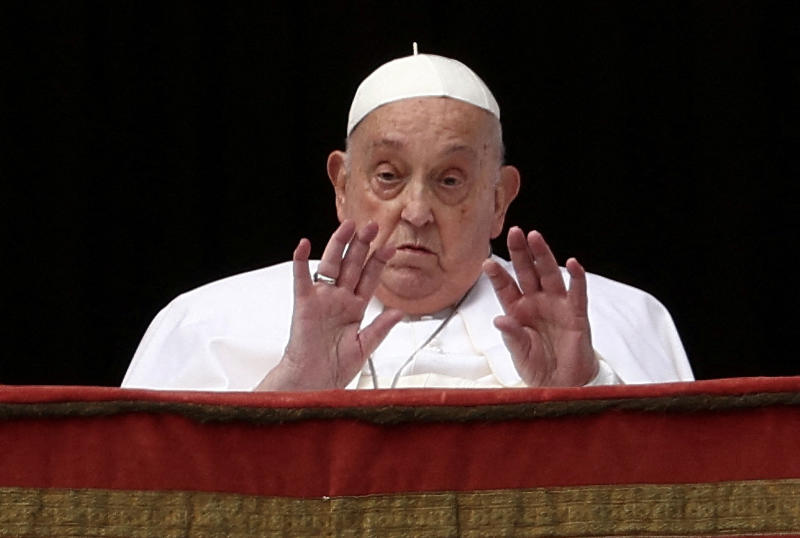 Pope Francis gestures from a balcony, on the day the "Urbi et Orbi" (to the city and to the world) message is delivered at St Peter's Square, on Easter Sunday, at the Vatican, on Sunday. (Photo: Reuters)