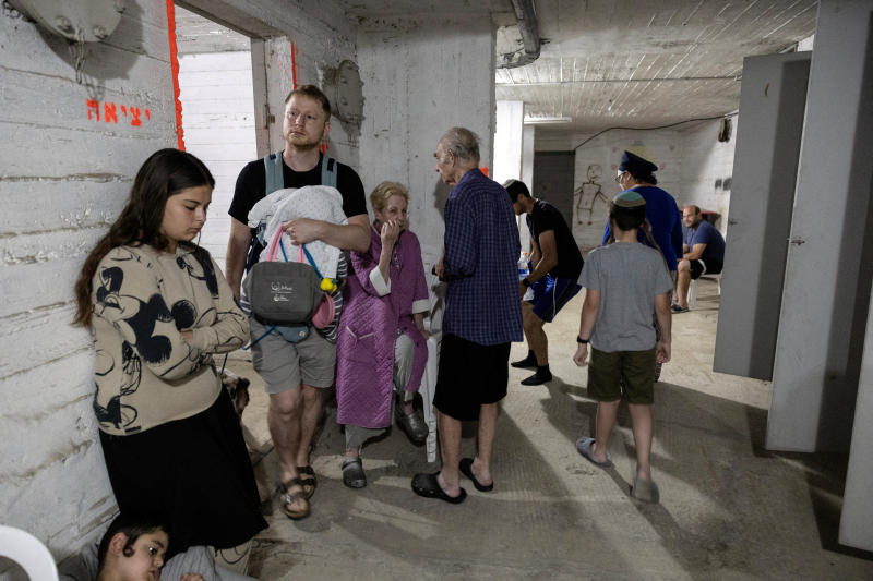 Israelis gather in a shelter following sirens in Tel Aviv, Israel, on Thursday. (Photo: Reuters)