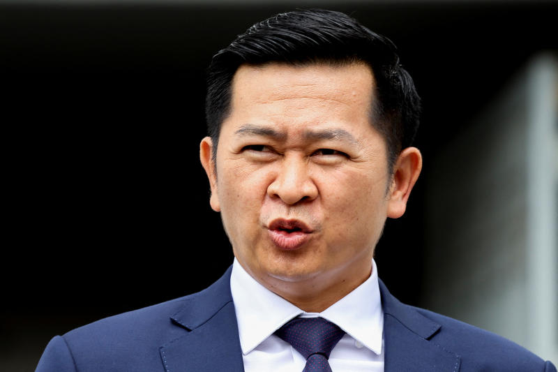 Winyat Chatmontre, lawyer of Thaksin Shinawatra, reacts as he walks out of the Supreme Court following the hearing on the legality of former Prime Minister Thaksin Shinawatra's six-month hospital stay before he was granted parole, in Bangkok, on Friday. (Reuters photo)