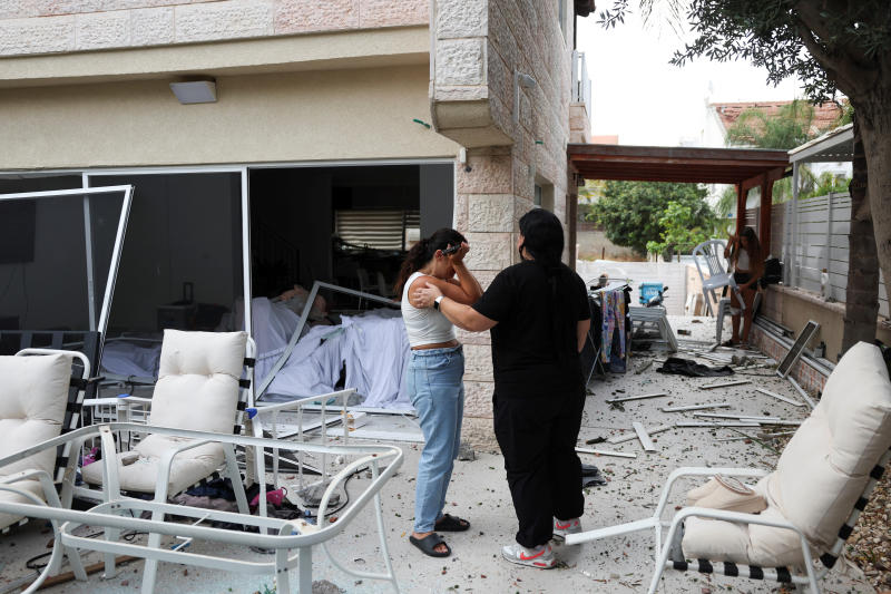 A woman reacts as she stands inside a damaged house at an impact site following missile attack from&nbsp;Iran&nbsp;on Israel, in Rishon LeZion, Israel,&nbsp;on Saturday. (Photo: Reuters)