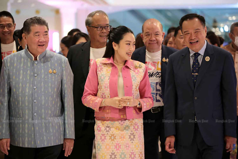 Prime Minister Paetongtarn Shinawatra, centre, and Deputy Prime Minister and Interior Minister Anutin Charnvirakul, right, attend a ceremony to launch a project to promote women's roles in Nonthaburi province on June 12. Chanat Katanyu