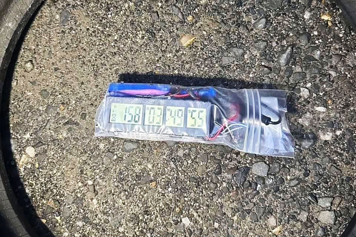 The bomb with a stopwatch found inside the car. (Photo: Phuket Information Centre)
