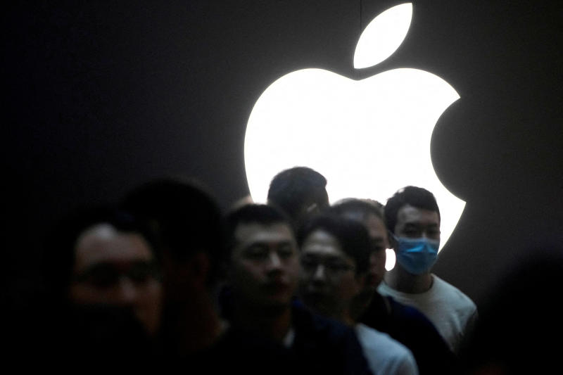 People line up while waiting at an Apple Store as Apple's new iPhone 15 officially goes on sale across China, in Shanghai, China, on Sept 22, 2023. (File photo: Reuters)