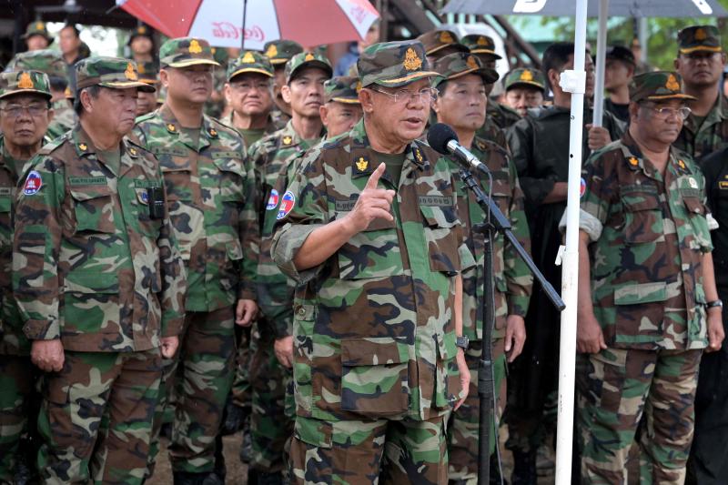 Cambodia's former leader Hun Sen, who is currently the Senate President and five-star General, speaks to soldiers during his visits of armed forces stationed along the Cambodia-Thailand border in Preah Vihear province on Thursday. (Pool photo)