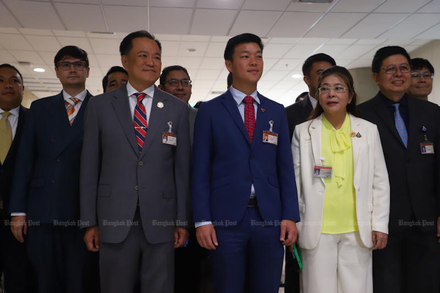 Opposition party members gather before their first meeting on Thursday, chaired by People’s Party leader Natthaphong Ruengpanyawut (front row centre). Among those joining were Bhumjaithai leader Anutin Charnvirakul (left) and Khunying Sudarat Keyuraphan (right) leader of Thai Sang Thai. (Photo: Nutthawat Wichieanbut)