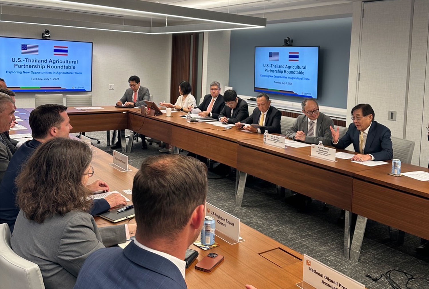 Finance Minister Pichai Chunhavajira, right, meets with representatives from the US Grains Council in Washington on July 3. The two sides were exploring further agricultural trade opportunities between Thailand and the US. (Photo: Royal Thai Government)
