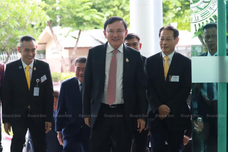 Former prime minister Thaksin Shinawatra, seen above arriving to give a lecture at the Narcotics Control Board on May 27, faces at least four more days of court hearings into his hospital stay this month. (Photo: Somchai Poomlard)