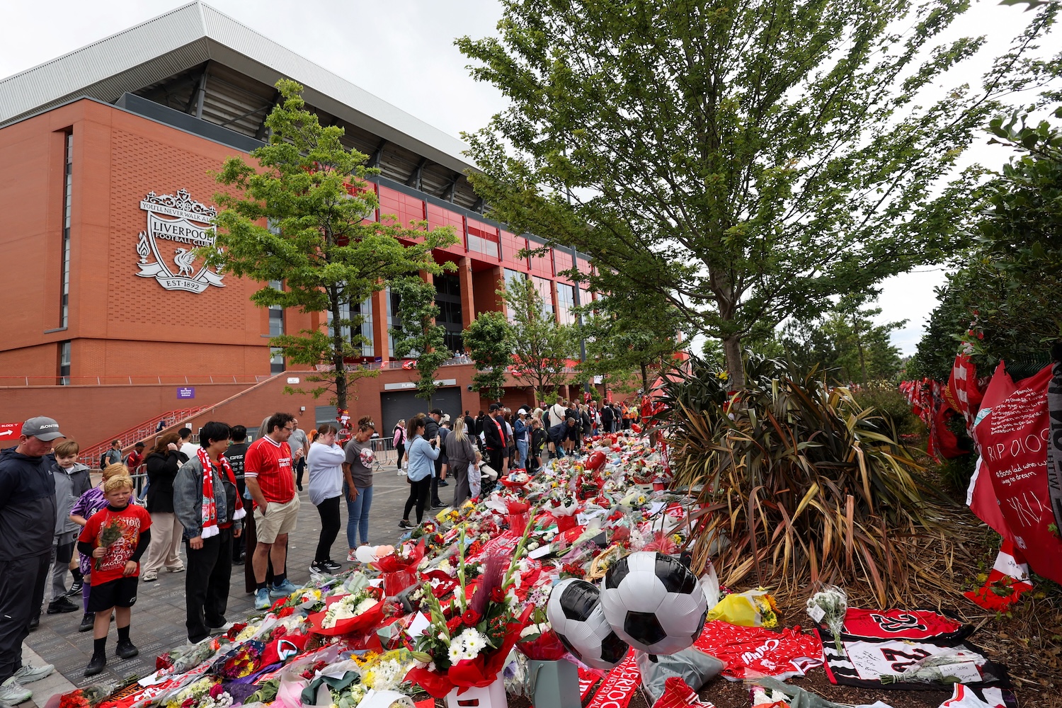 Fans pay their respects outside Anfield Stadium, on the day of the funeral of Liverpool forward Diogo Jota in Portugal. (Photo: Reuters)