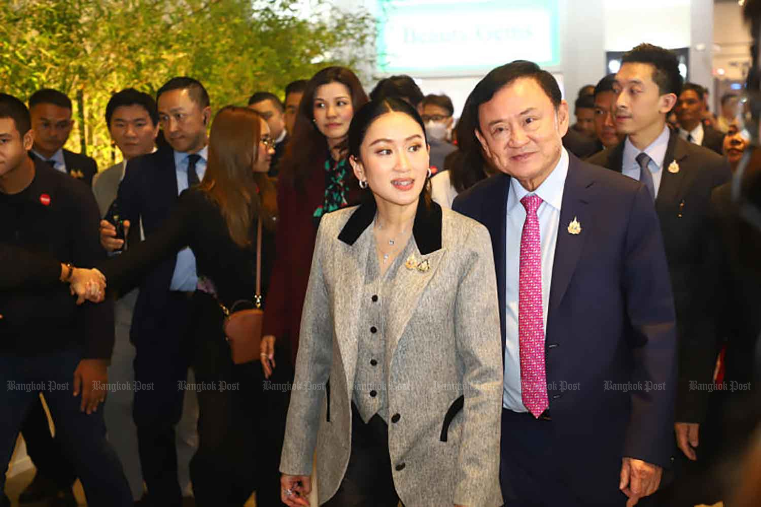 Suspended Prime Minister Paetongtarn Shinawatra and her father Thaksin Shinawatra arrive for a soft power forum at the Queen Sirikit National Convention Center in Bangkok on July 9. (Photo: Nutthawat Wichieanbut)