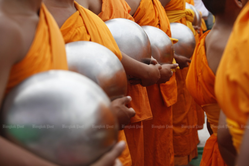How much do Thai monks earn per month?