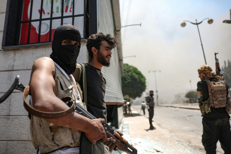 Clashes, homes torched in south Syria's Sweida despite ceasefire