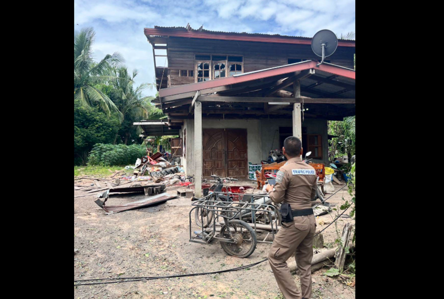 A police officer inspects a house in Kap Choeng district of Surin after rockets fired by Cambodian forces struck civilian targets on Thursday morning. (Photo: Royal Thai Army public relations)  A police officer inspects a house in Kap Choeng district of Surin after rockets fired by Cambodian forces struck civilian targets on Thursday morning. (Photo: Royal Thai Army public relations)                  