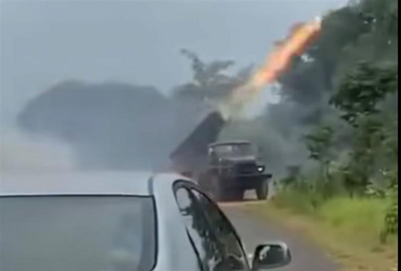 Cambodian forces fire a BM-21 rocket launcher from their base at Khao Laem on Thursday morning. One of the rockets was said to have landed on the Thai side, striking an area near Ban Tuan in Si Sa Ket province. (Image from video posted by Chumchon Khon Surin Facebook page)