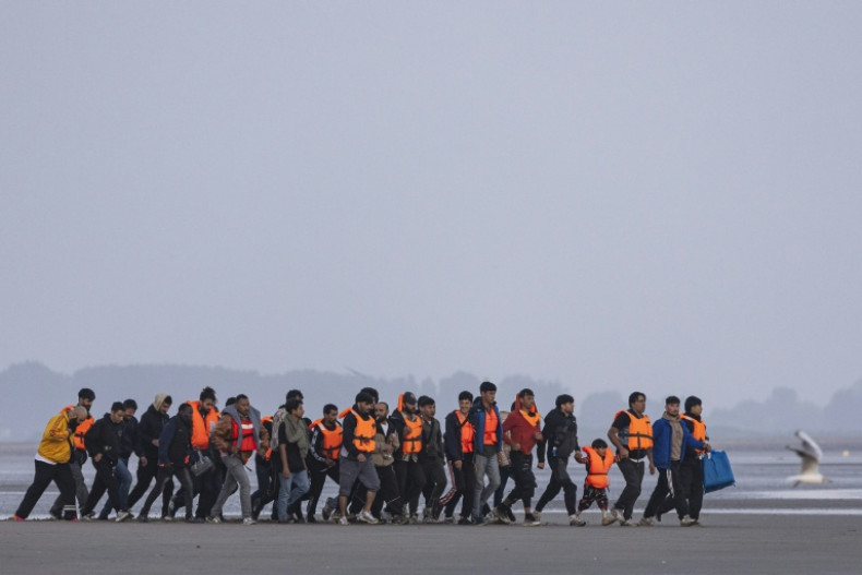 UK says first migrants held under return deal with France