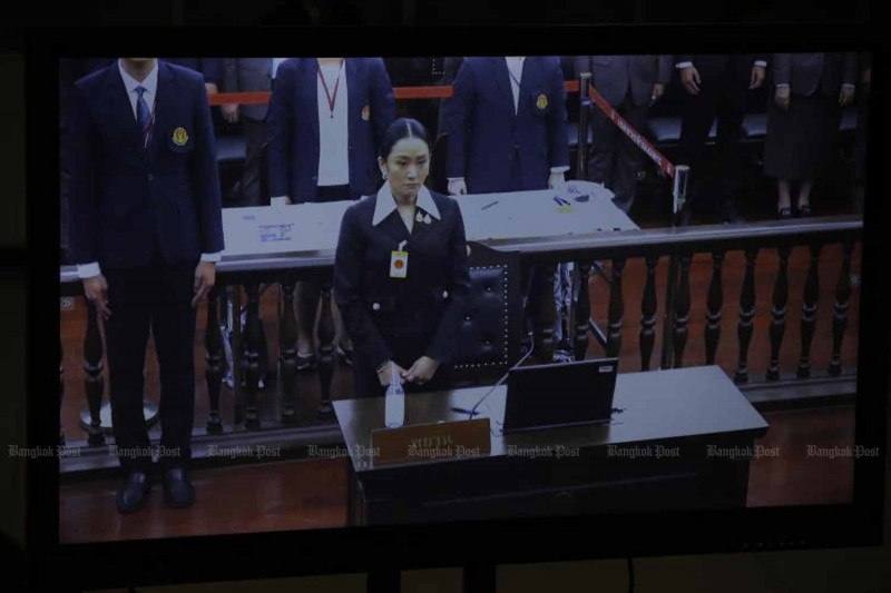 In a video provided by the Constitutional Court, suspended Prime Minister Paetongtarn Shinawatra stands before the judges at the beginning of her testimony in the Hun Sen phone call case on Thursday. (Photo: Pattarapong Chatpattarasill)
