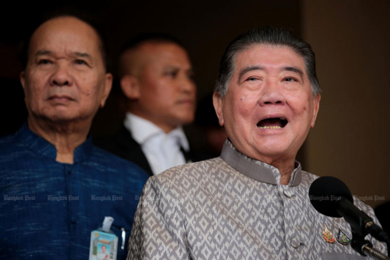 Deputy Prime Minister Phumtham Wechayachai, right, who is currently caretaker prime minister, speaks to reporters after the weekly cabinet meeting on Tuesday. (Photo: Chanat Katanyu)