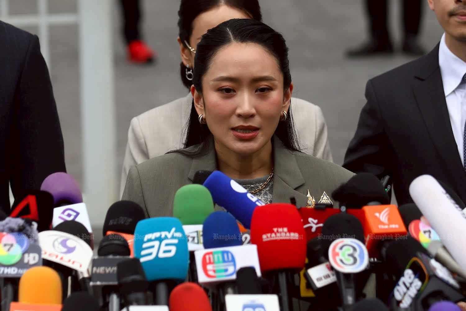 Paetongtarn Shinawatra speaks to reporters in front of the Supreme Court after the ruling on Tuesday. Nutthawat Wichieanbut