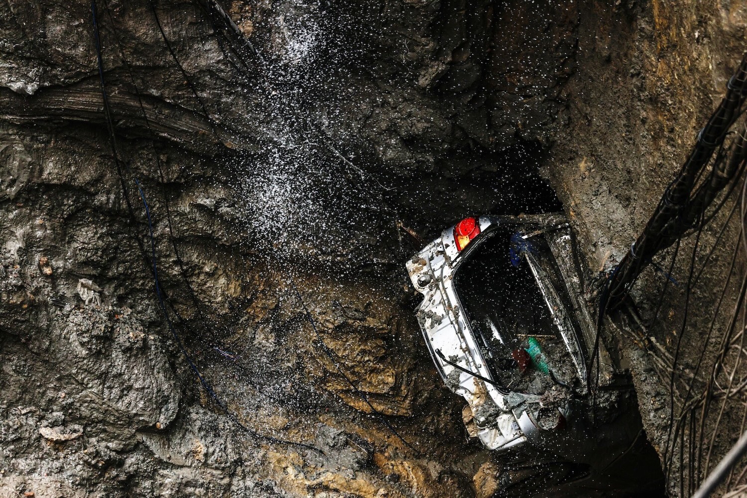 The sinkhole swallowed a car belonging to a police officer. (Photo: Bloomberg)  