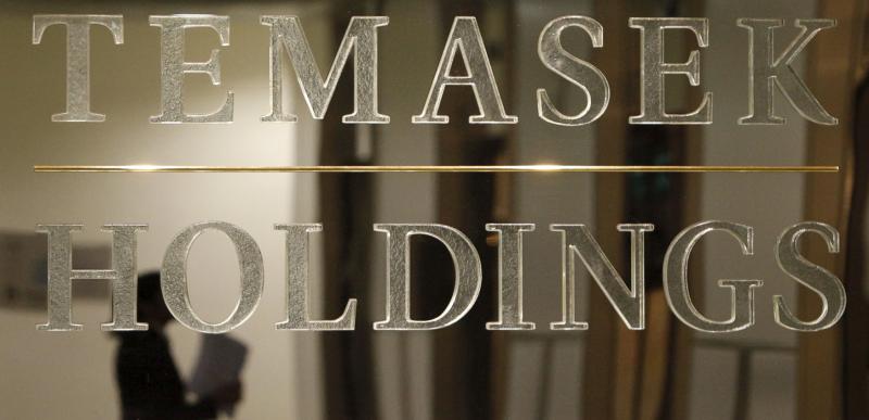A staff member is reflected in a Temasek Holdings logo at their headquarters in Singapore on Sept 17, 2009. (File photo: Reuters) A staff member is reflected in a Temasek Holdings logo at their headquarters in Singapore on Sept 17, 2009. (File photo: Reuters)